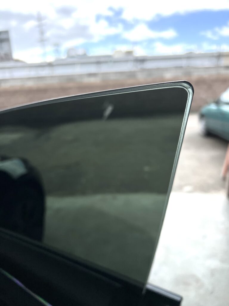 Tinted car windows reflecting low light—used to illustrate “reasons not to tint car windows,” including reduced nighttime visibility and safety risks.