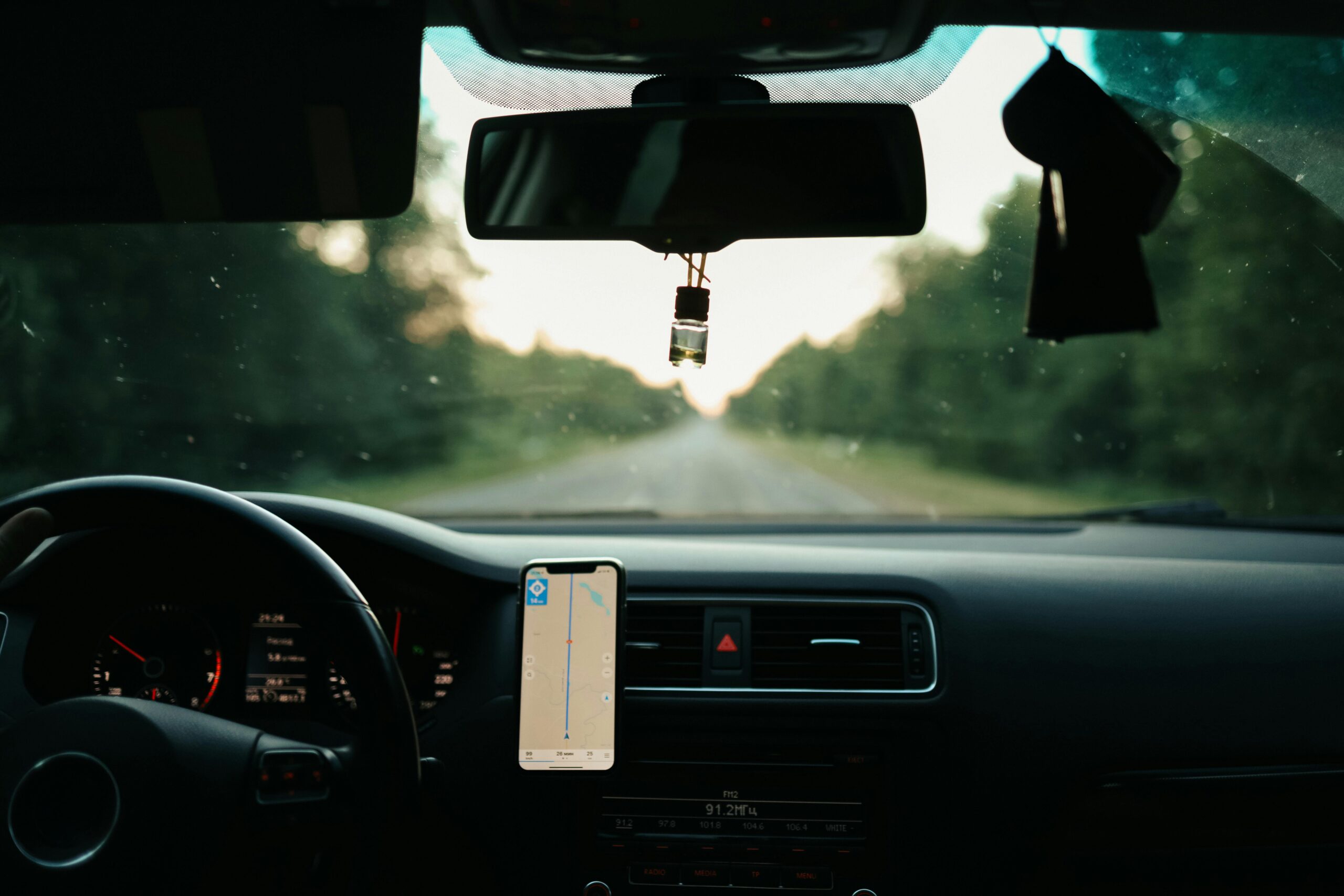 A sleek, well-maintained car with a glossy finish, showcasing the enhanced aesthetics achieved through professional detailing and window tinting